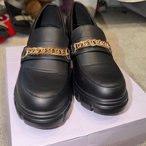 JustFab Black Loafers with Gold Chain Accent